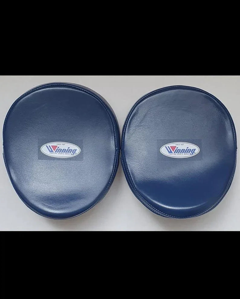 Two blue side pads with a logo of Winning