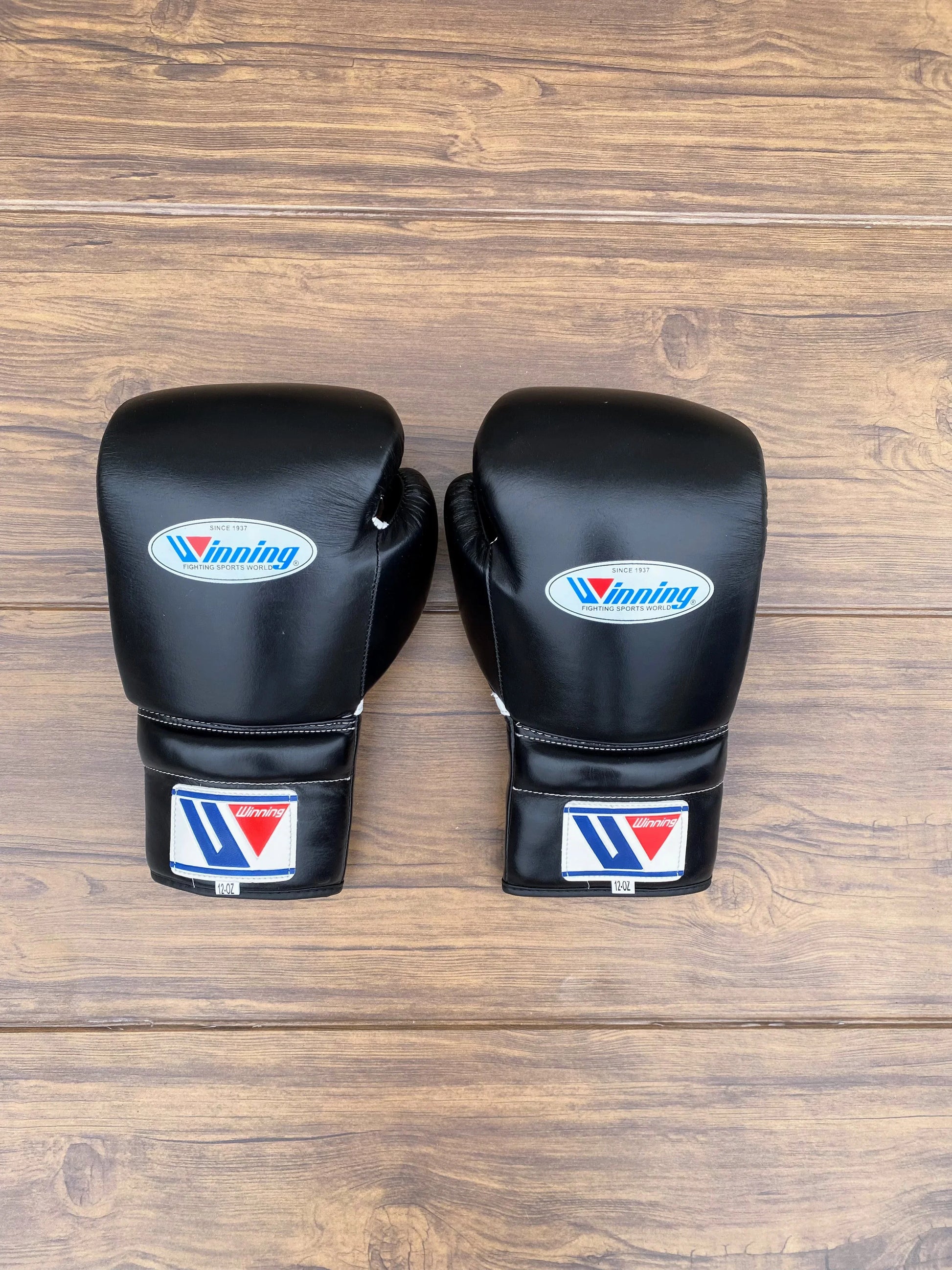 Front and back of Winning Black Boxing Gloves Front pair view