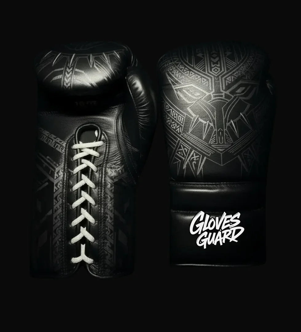 Black boxing gloves with tribal patterns and 'Gloves Guard' branding on a black background